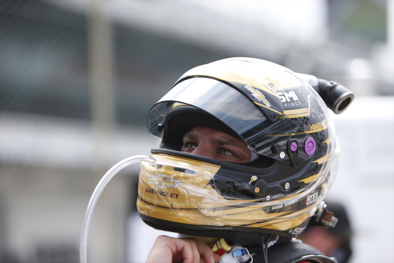Sage Karam straps on his helmet along pit lane prior to practice for the GMR Grand Prix on the Indianapolis Motor Speedway Road Course -- Photo by: Chris Jones