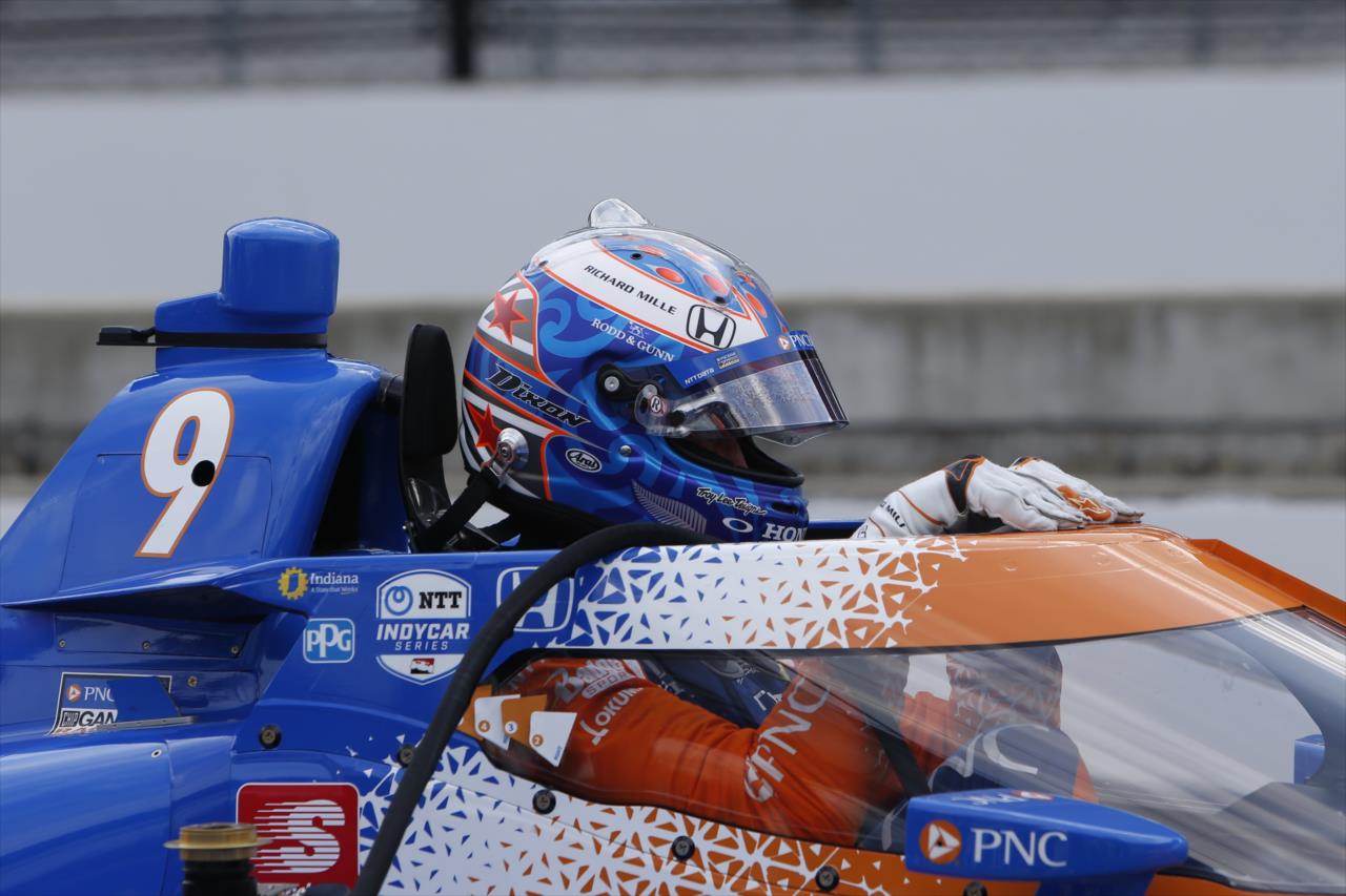 Scott Dixon slides into his No. 9 PNC Bank Honda on pit lane during practice for the GMR Grand Prix on the Indianapolis Motor Speedway Road Course -- Photo by: Chris Jones