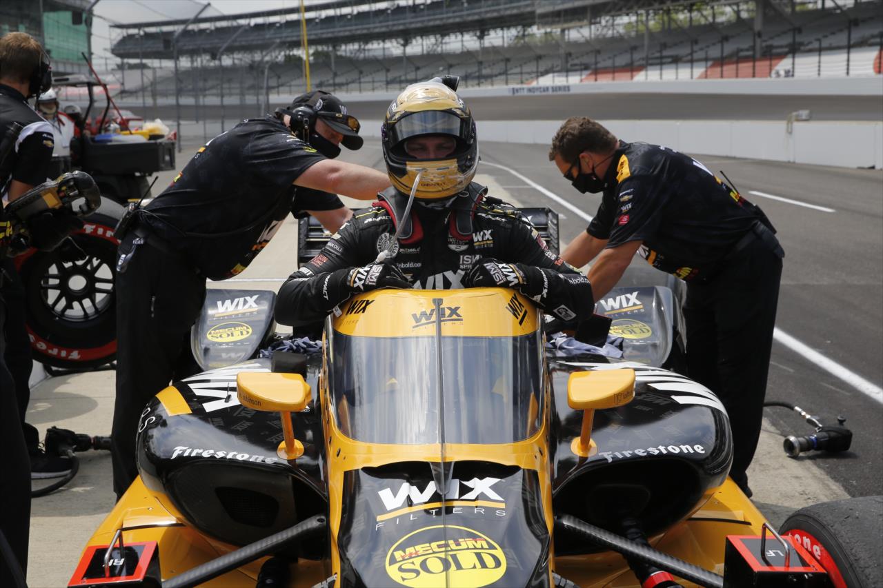 Sage Karam slides into his No. 24 WIX Filters Chevrolet on pit lane prior to practice for the GMR Grand Prix on the Indianapolis Motor Speedway Road Course -- Photo by: Chris Jones