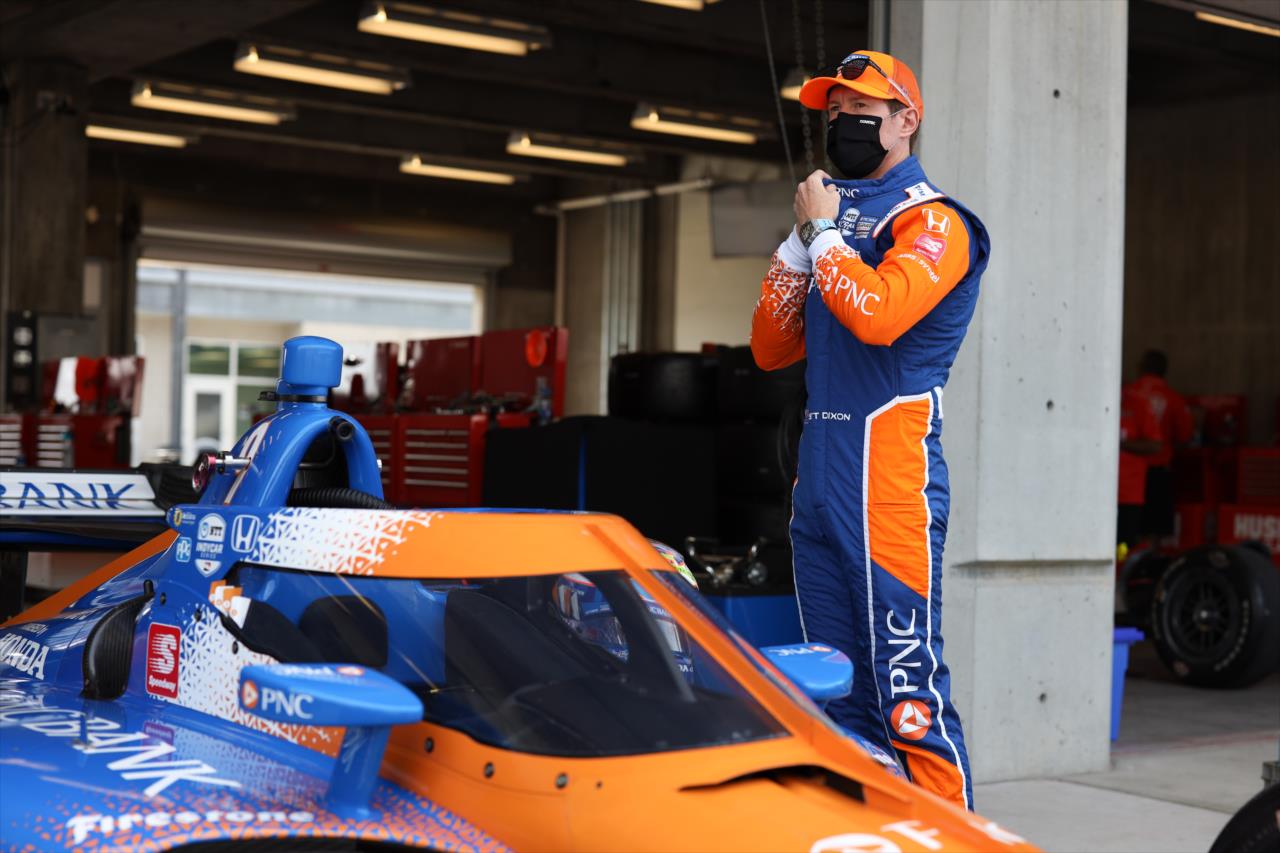 Scott Dixon adjusts his firesuit back in the paddock prior to practice for the GMR Grand Prix on the Indianapolis Motor Speedway Road Course -- Photo by: Chris Owens