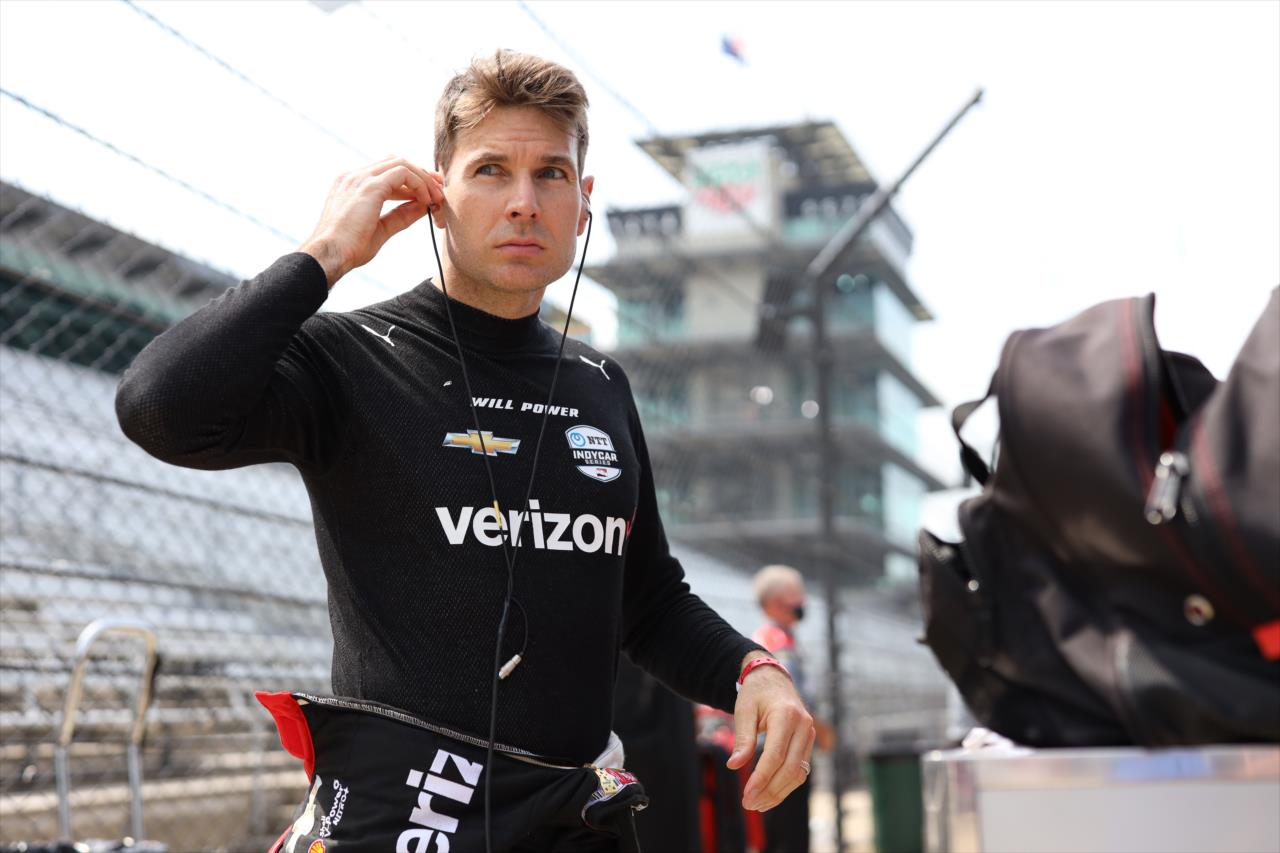 Will Power sets his earpieces along pit lane prior to practice for the GMR Grand Prix on the Indianapolis Motor Speedway Road Course -- Photo by: Chris Owens