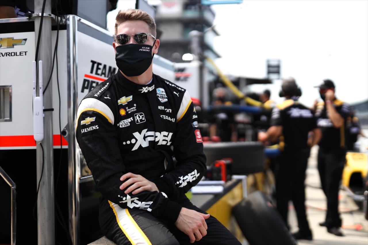 Josef Newgarden waits along pit lane prior to practice for the GMR Grand Prix on the Indianapolis Motor Speedway Road Course -- Photo by: Chris Owens
