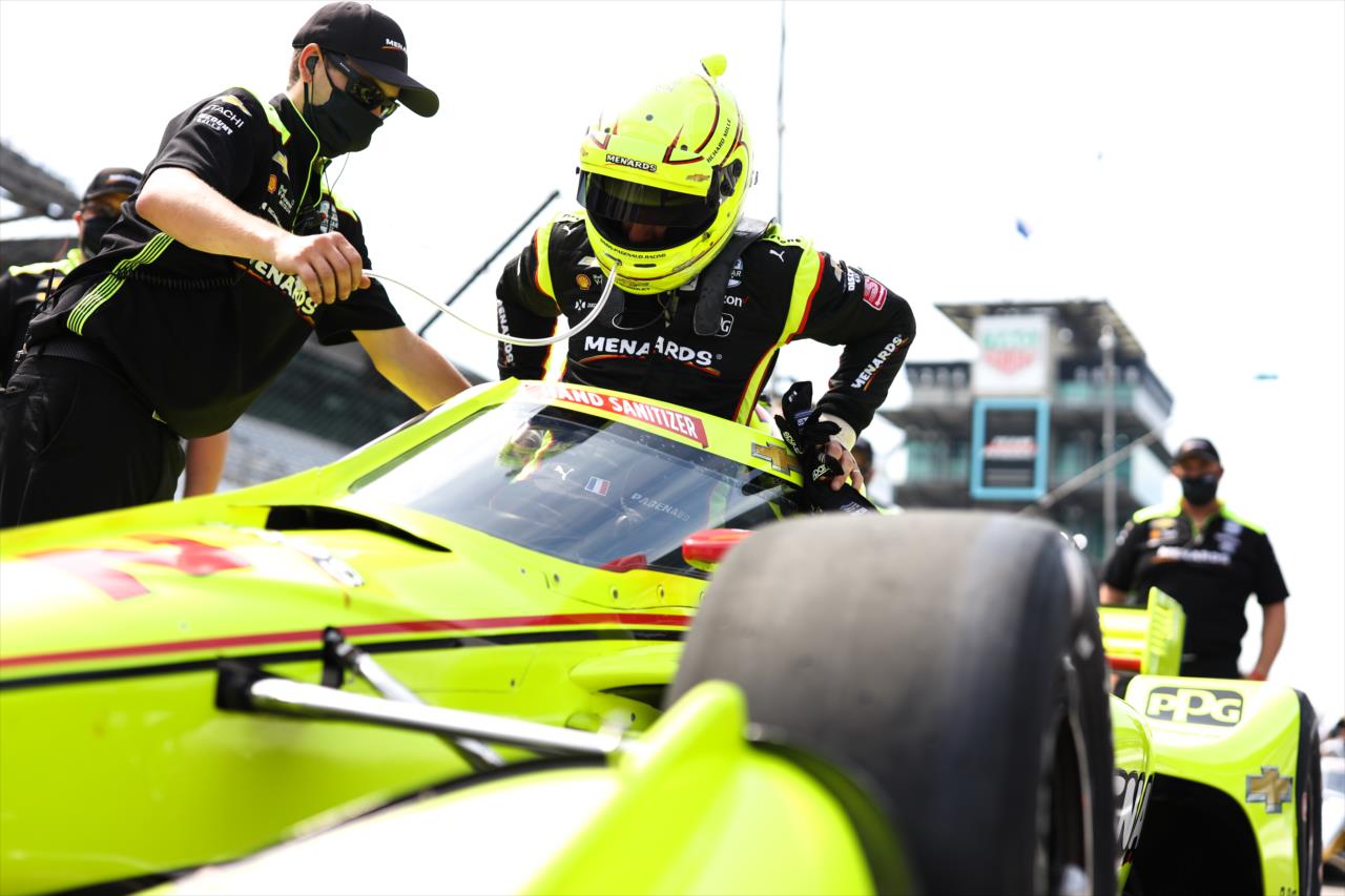 Simon Pagenaud slides into his No. 22 Menards Chevrolet on pit lane prior to practice for the GMR Grand Prix on the Indianapolis Motor Speedway Road Course -- Photo by: Chris Owens