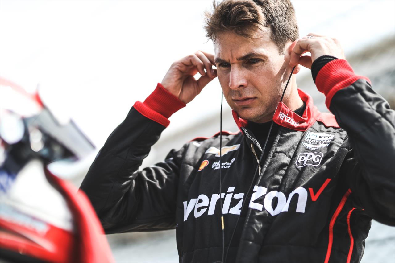 Will Power sets his earpieces along pit lane prior to practice for the GMR Grand Prix on the Indianapolis Motor Speedway Road Course -- Photo by: Joe Skibinski