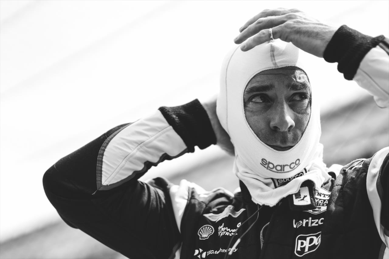 Simon Pagenaud adjusts his balaclava along pit lane prior to practice for the GMR Grand Prix on the Indianapolis Motor Speedway Road Course -- Photo by: Joe Skibinski