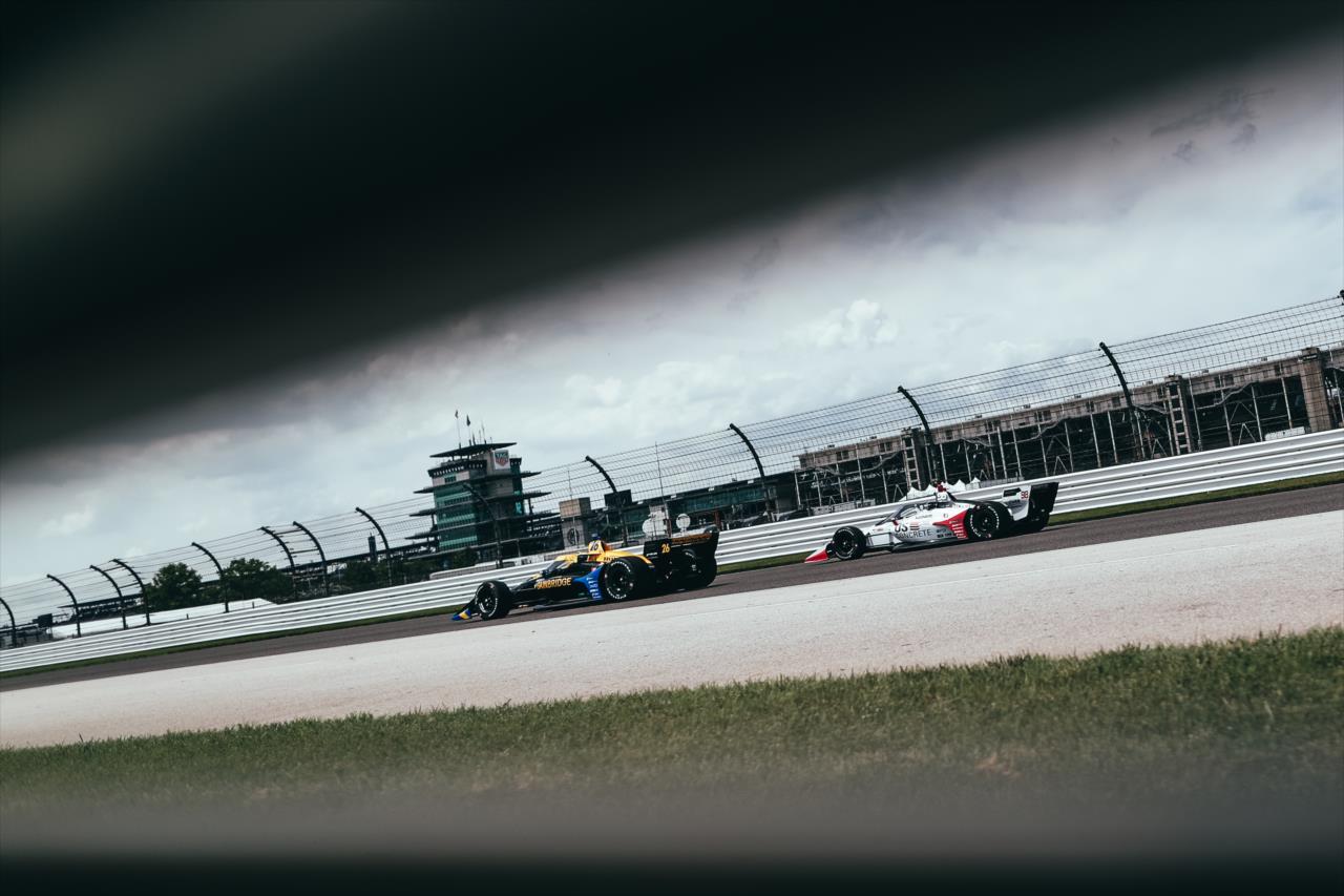 Teammates Zach Veach and Marco Andretti sail down the Hulman Boulevard backstretch during practice for the GMR Grand Prix on the Indianapolis Motor Speedway Road Course -- Photo by: Joe Skibinski