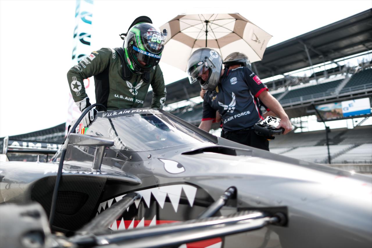 Conor Daly slides into his No. 20 USAF Chevrolet on pit lane prior to qualifications for the GMR Grand Prix on the Indianapolis Motor Speedway Road Course -- Photo by: Joe Skibinski