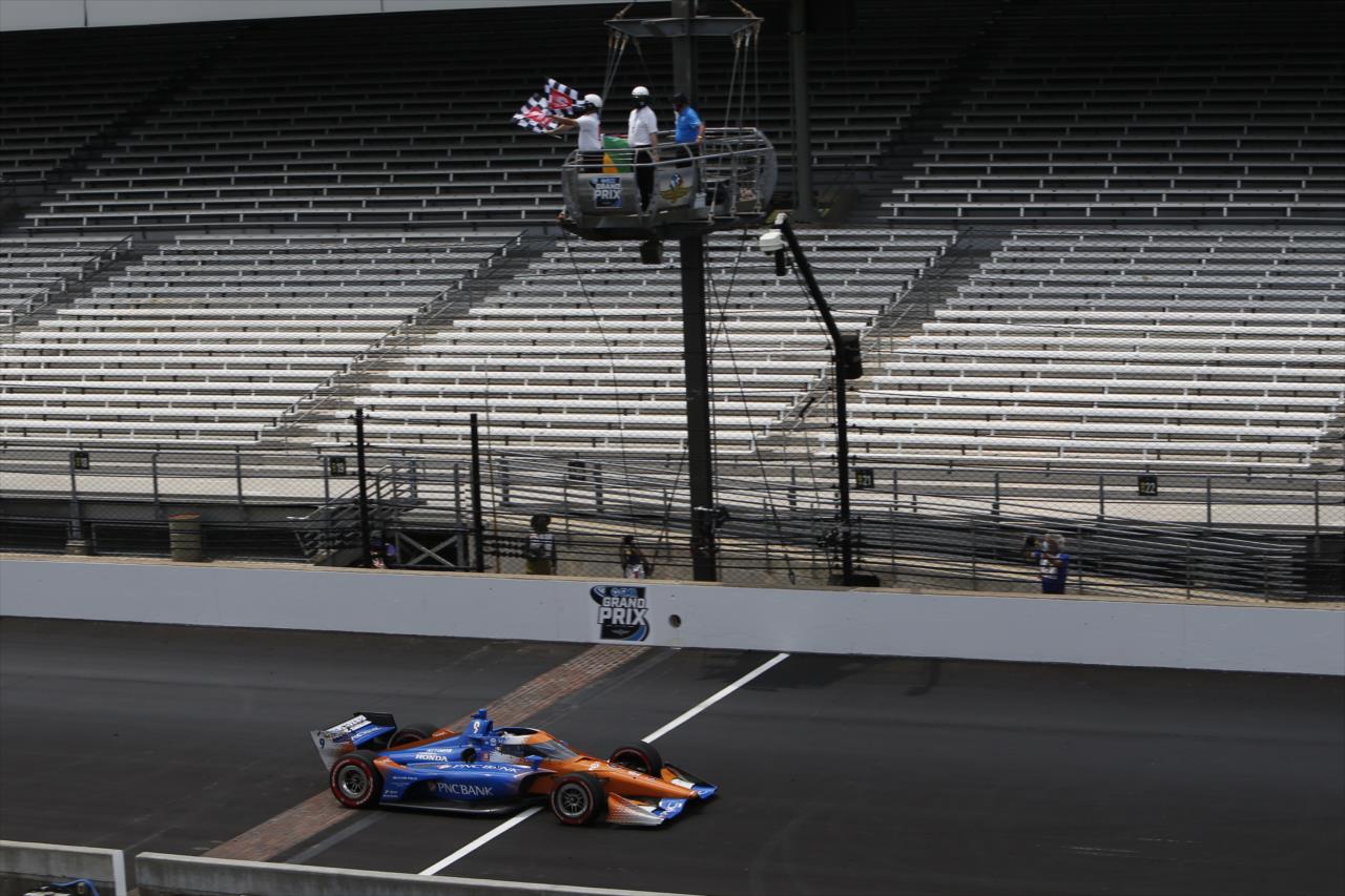 Scott Dixon takes the twin checkered flags to win the 2020 GMR Grand Prix at the Indianapolis Motor Speedway -- Photo by: Chris Jones