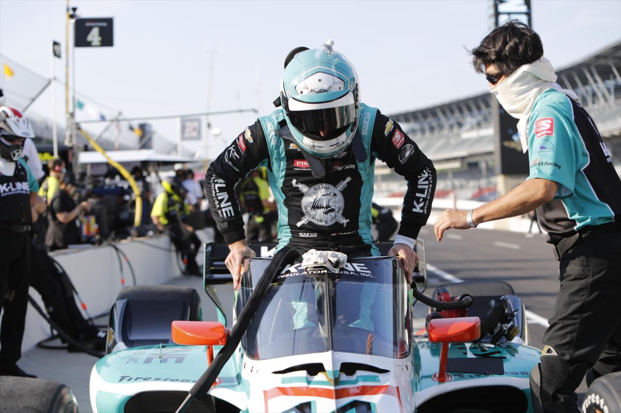 Dalton Kellett slides into his No. 14 K-Line Insulators Chevrolet on pit lane prior to the final warmup for the 2020 GMR Grand Prix at the Indianapolis Motor Speedway -- Photo by: Chris Jones