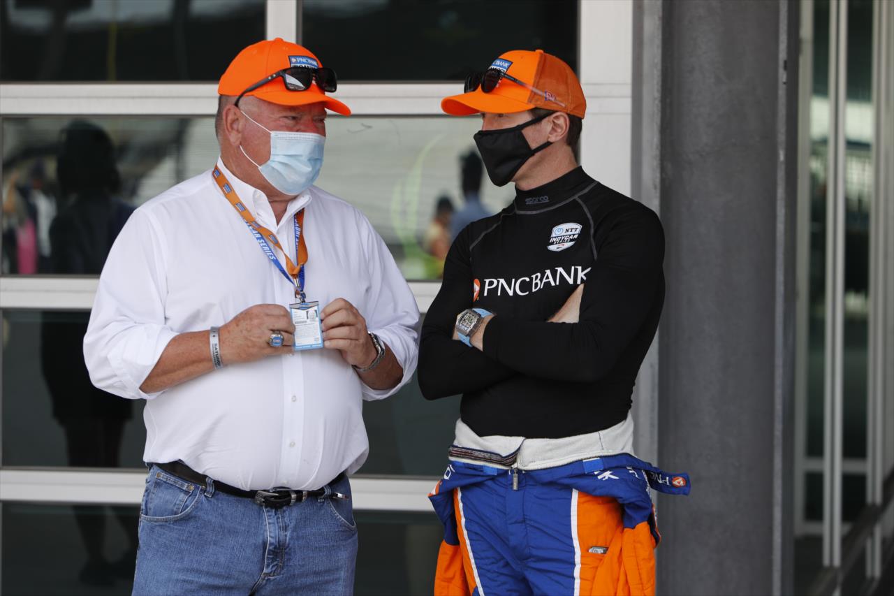 Scott Dixon chats with team owner Chip Ganassi in the paddock prior to the start of the 2020 GMR Grand Prix at the Indianapolis Motor Speedway -- Photo by: Chris Jones