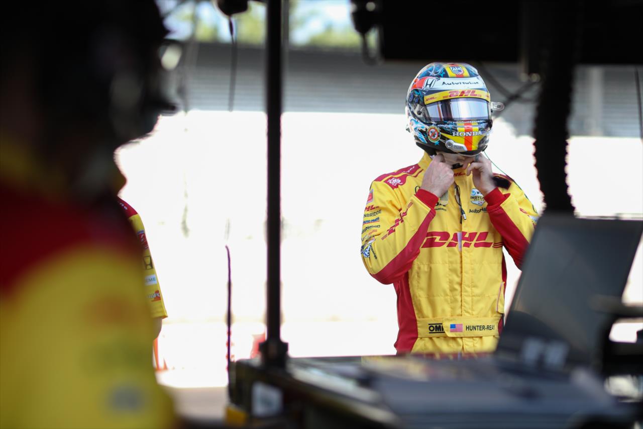 Ryan Hunter-Reay straps on his helmet along pit lane prior to the start of the final warmup for the 2020 GMR Grand Prix at the Indianapolis Motor Speedway -- Photo by: Chris Owens