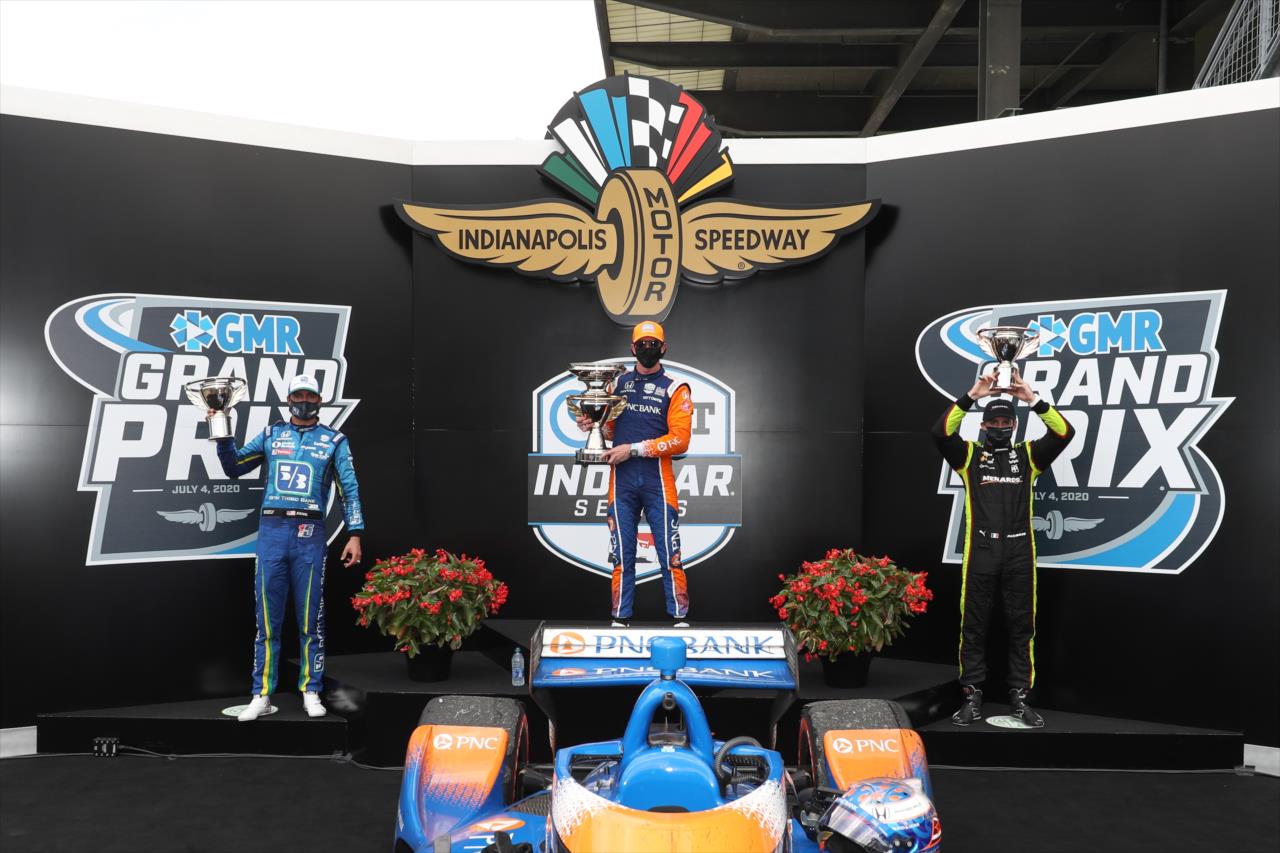 The podium of Scott Dixon, Graham Rahal, and Simon Pagenaud with their trophies in Victory Circle following the 2020 GMR Grand Prix at the Indianapolis Motor Speedway -- Photo by: Chris Owens