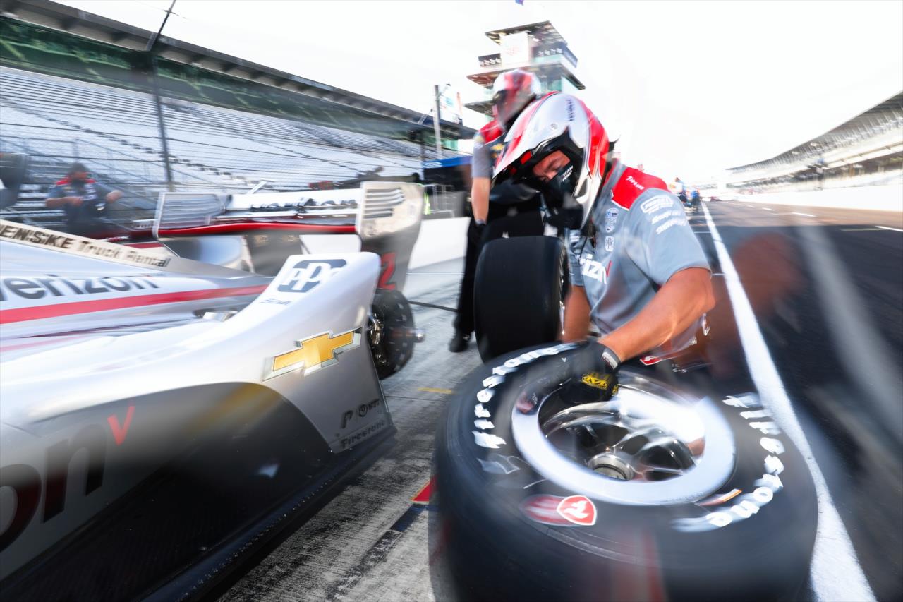 A Team Penske crewman readies to mount a rear tire on the No. 12 Verizon Chevrolet of Will Power during the final warmup for the 2020 GMR Grand Prix at the Indianapolis Motor Speedway -- Photo by: Chris Owens