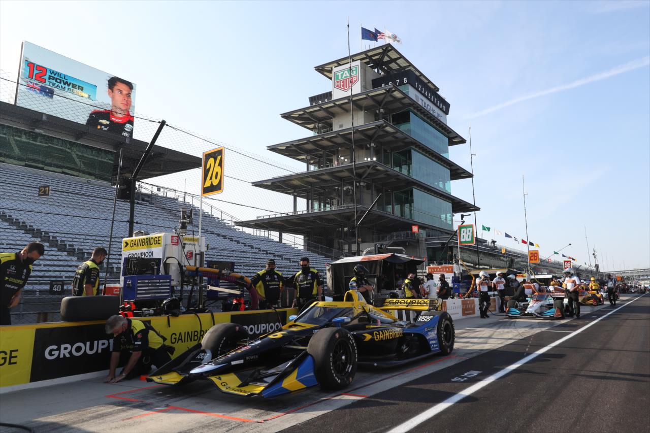 The No. 26 Gainbridge Honda of Zach Veach sits on pit lane prior to the start of the final warmup for the 2020 GMR Grand Prix at the Indianapolis Motor Speedway -- Photo by: Chris Owens