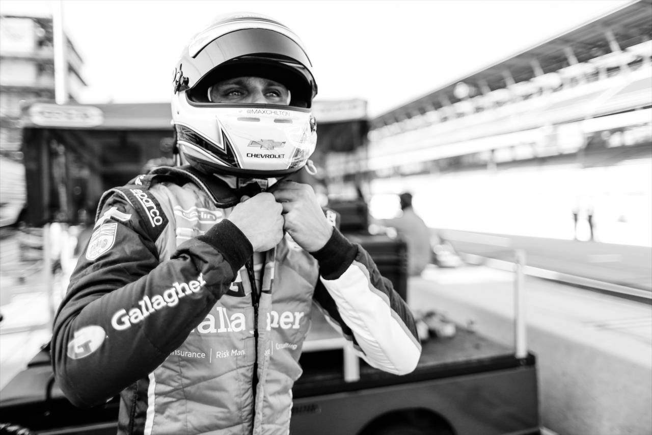 Max Chilton straps on his helmet along pit lane prior to the start of the final warmup for the 2020 GMR Grand Prix at the Indianapolis Motor Speedway -- Photo by: Joe Skibinski