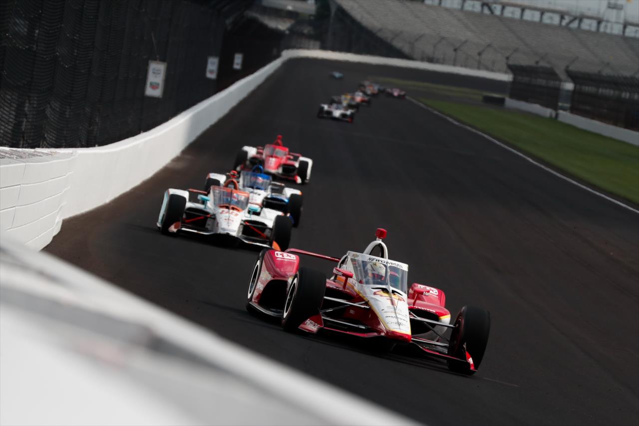 Josef Newgarden leads a train of cars into Turn 3 during Practice 1 for the 104th Indianapolis 500 -- Photo by: Joe Skibinski