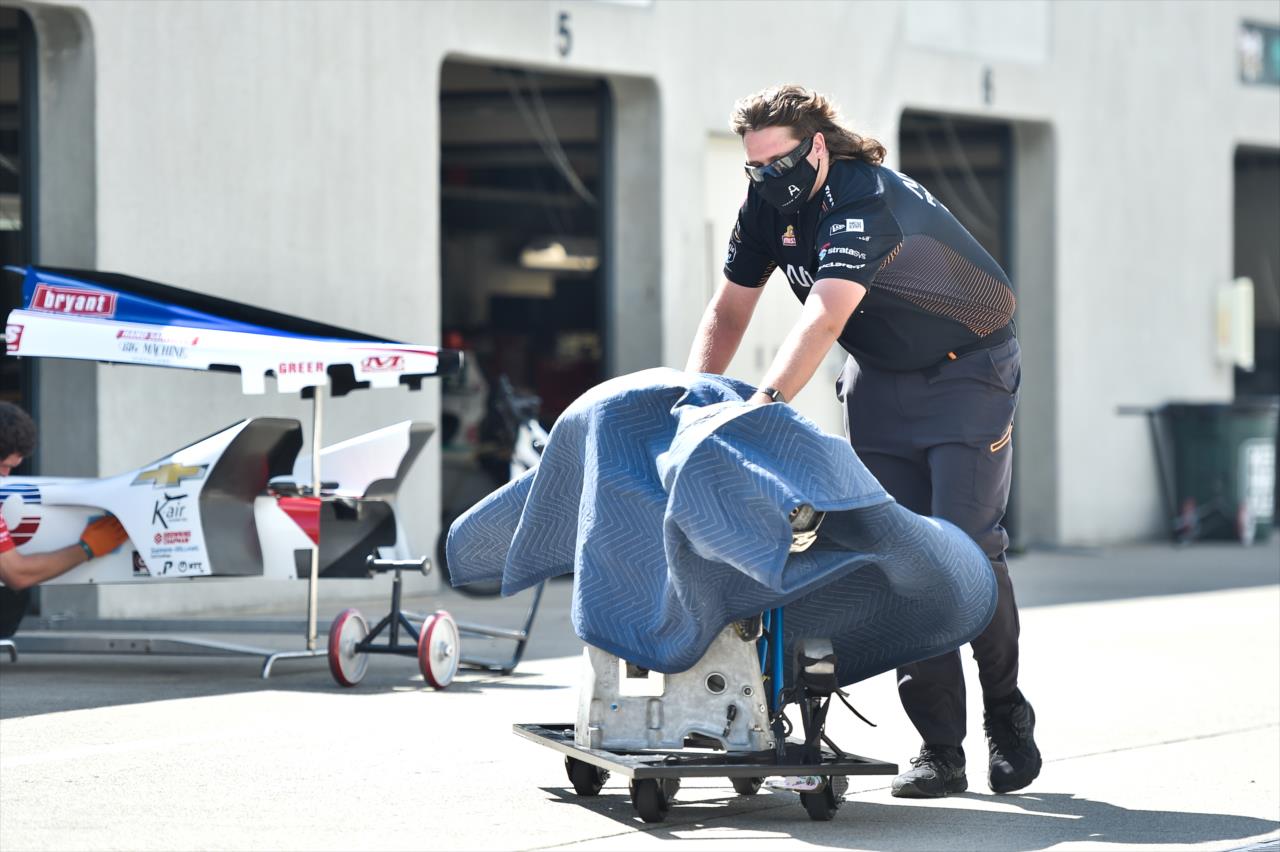 An Arrow McLaren SP crew member pushes parts through Gasoline Alley on Pole Day for the Indianapolis 500 at the Indianapolis Motor Speedway Sunday, August 16, 2020 -- Photo by: Chris Owens