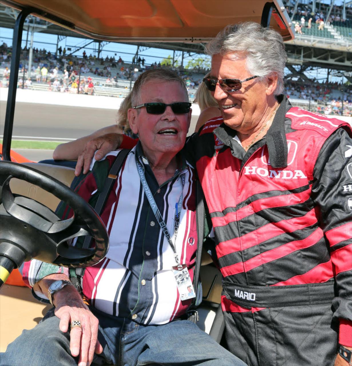 Bobby Unser chats with Mario Andretti during pre-race fesitivites prior to the start of the 2018 Indianapolis 500