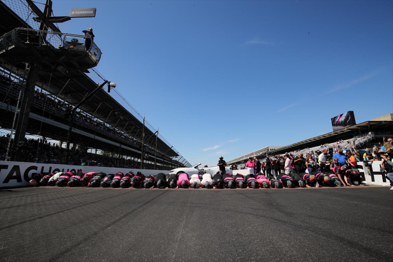 Helio Castroneves and crew Kiss the Bricks - 105th Running of the Indianapolis 500 presented by Gainbridge -- Photo by: Joe Skibinski