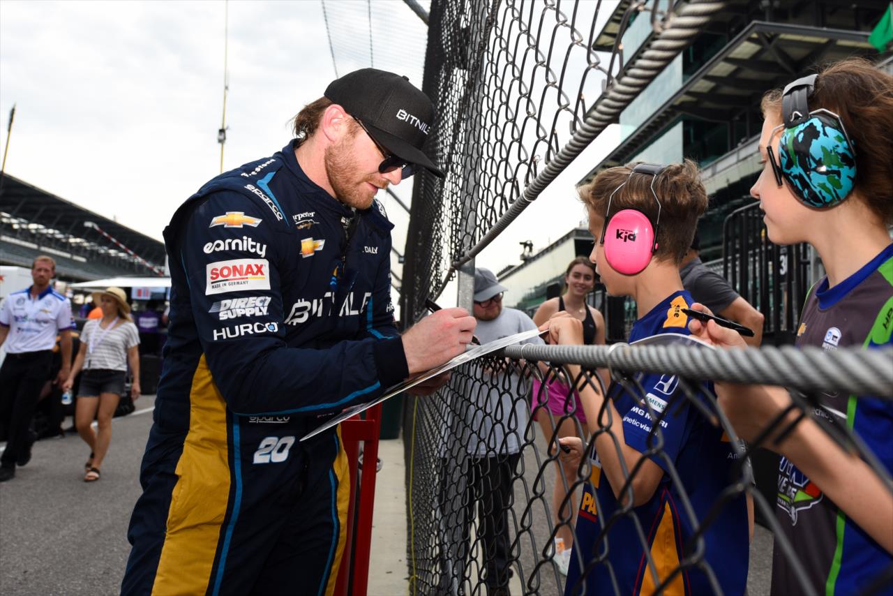 Conor Daly signs an autograph for a fan - Indianapolis 500 Practice - By: James Black -- Photo by: James  Black