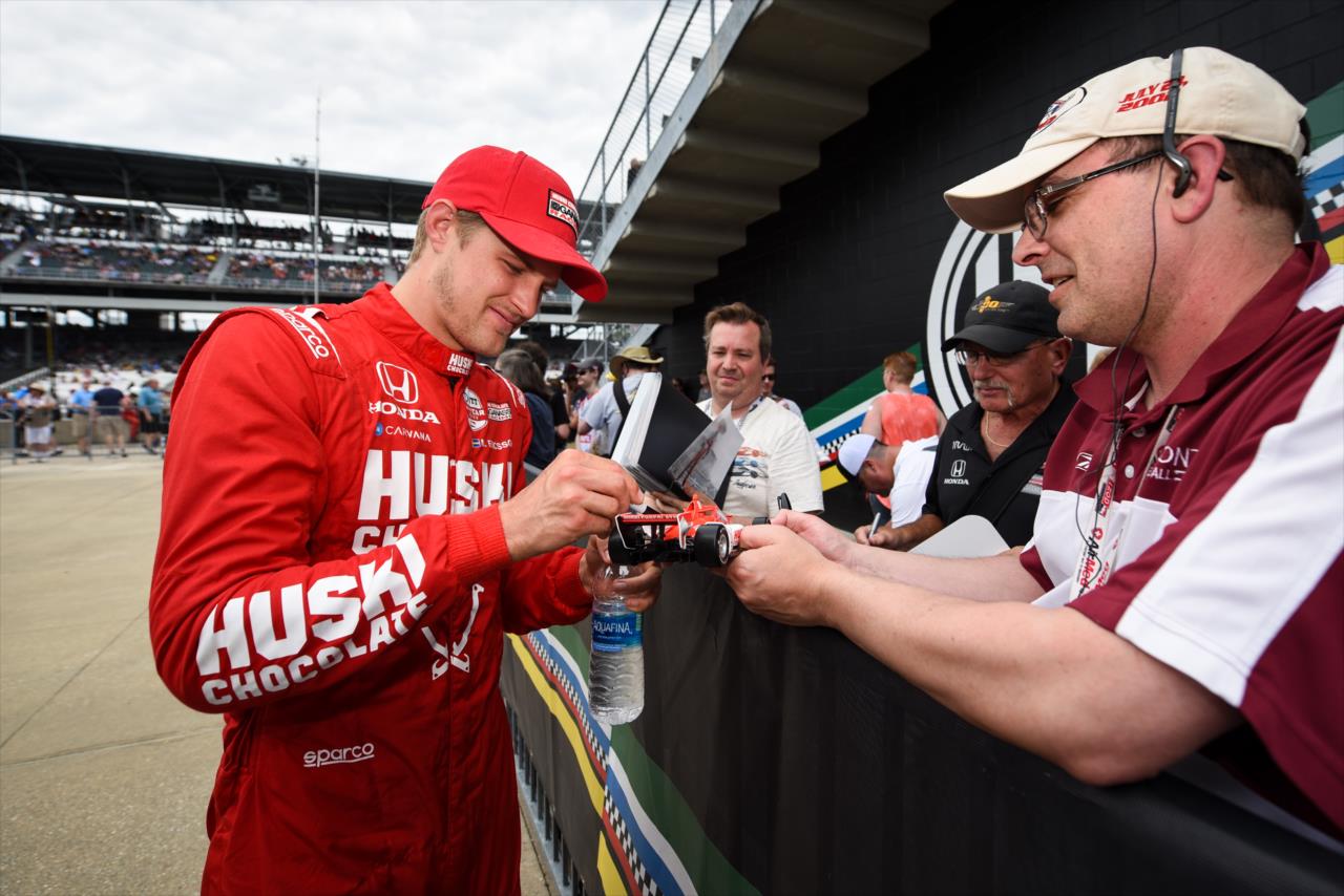 Marcus Ericsson signs an autograph for a fan - PPG Presents Armed Forces Qualifying - By: James Black -- Photo by: James  Black
