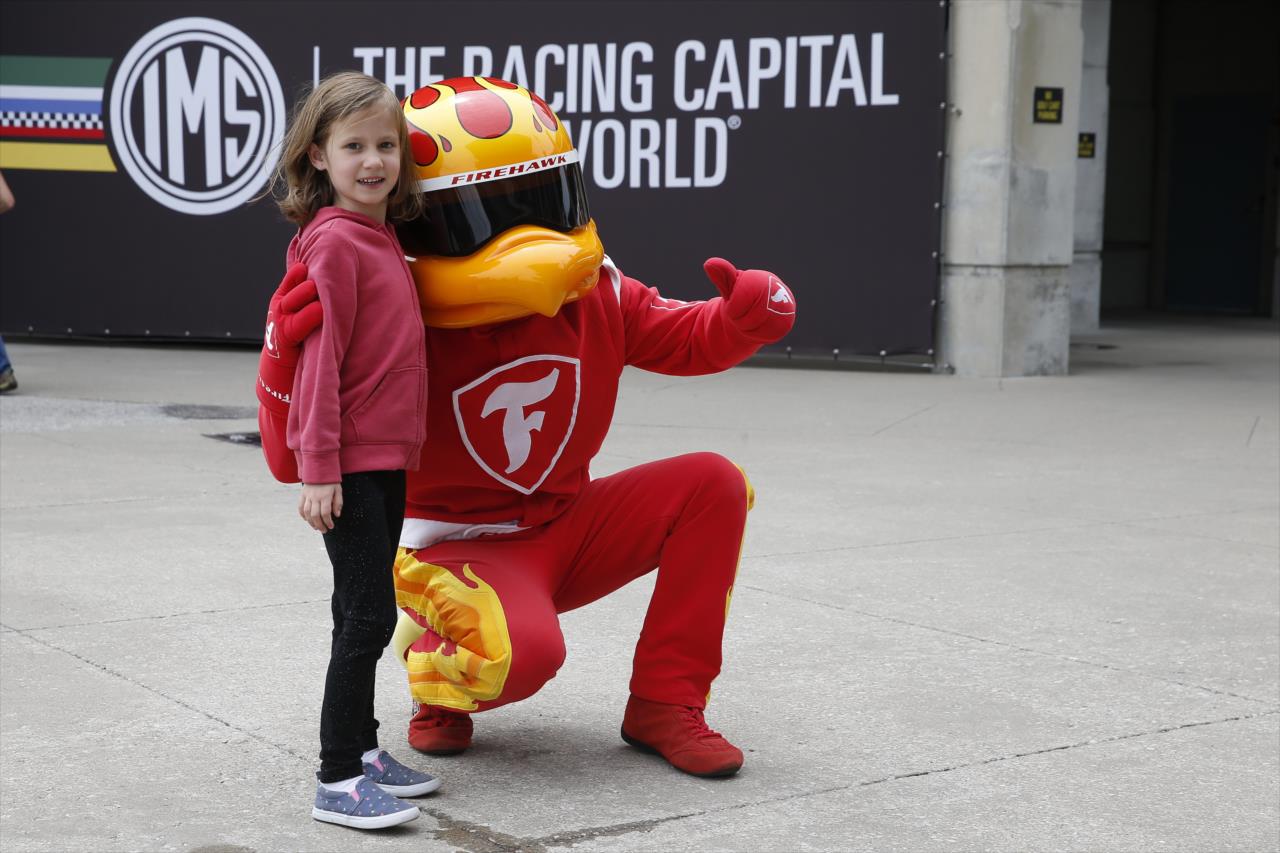 Firestone Firehawk with a young fan - PPG Presents Armed Forces Qualifying - By: Chris Jones -- Photo by: Chris Jones