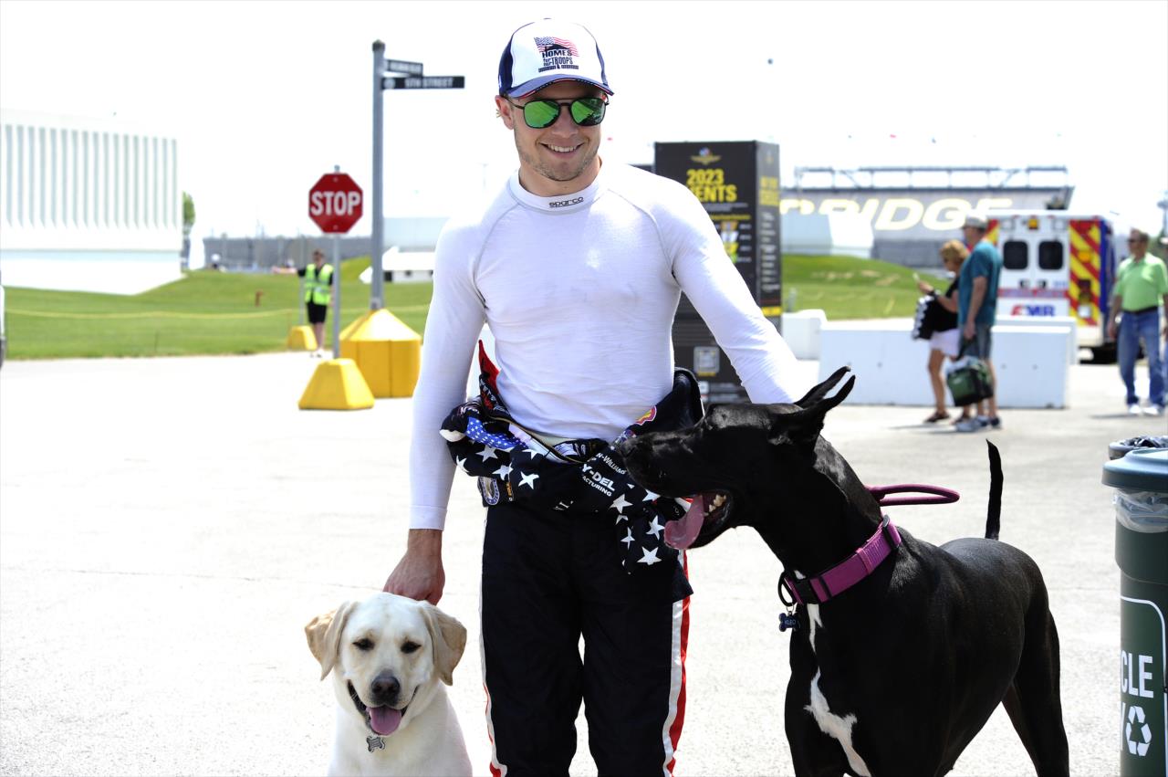 Santino Ferrucci with his pups - Indianapolis 500 Practice - By: Mike Young -- Photo by: Mike Young