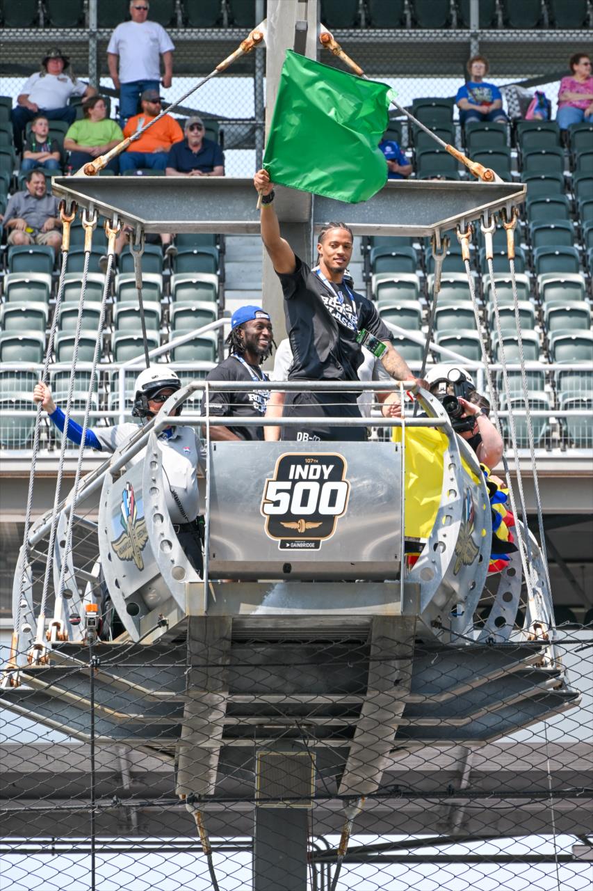 Indianapolis Colts rookie JuJu Brents waives the green flag - Indianapolis 500 Practice - By: Doug Mathews -- Photo by: Doug Mathews
