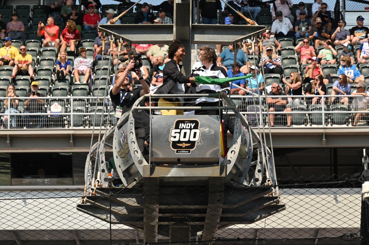 Tamika Catchings flies the green flag - Indianapolis 500 Qualifying Day 1 - By: Karl Zemlin -- Photo by: Dana Garrett