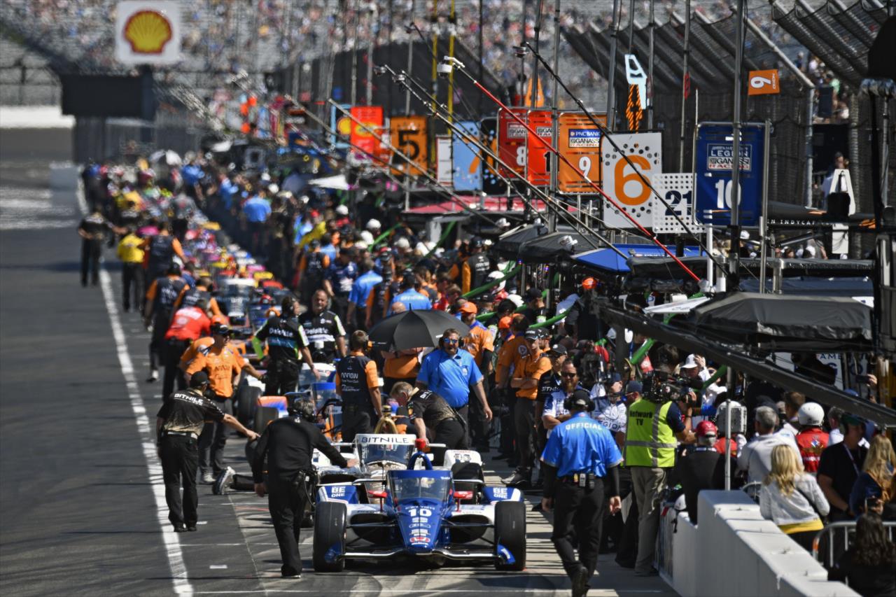 Pit lane comes to life - Miller Lite Carb Day - By: Walt Kuhn -- Photo by: Walt Kuhn