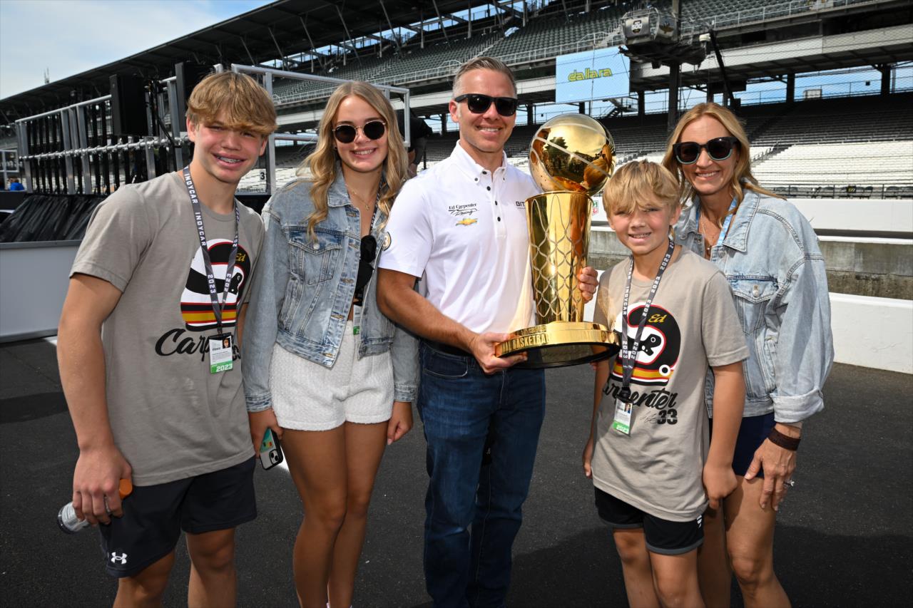 Ed Carpenter and family with the Larry O'Brien Championship Trophy - Legends Day by Firestone - By: James Black -- Photo by: James  Black
