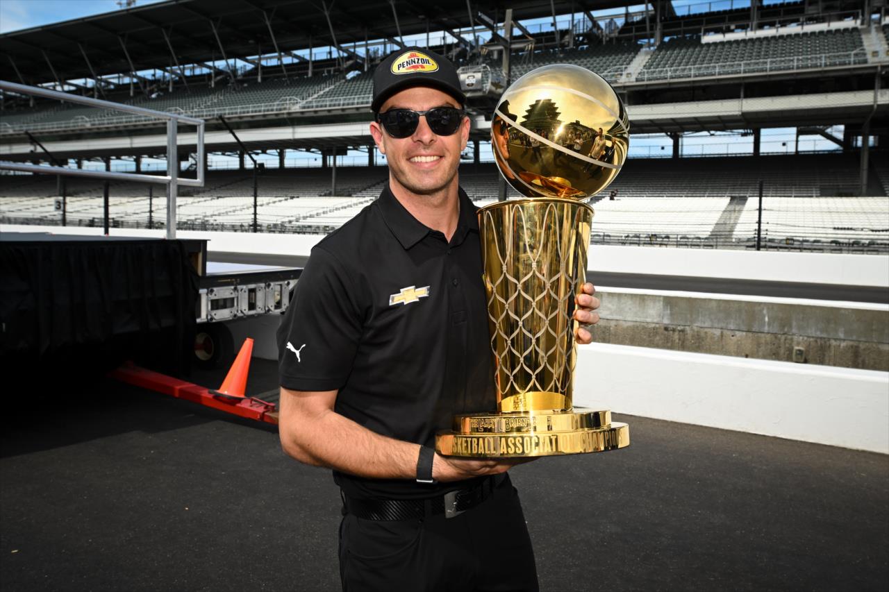 Scott McLaughlin with the Larry O'Brien Championship Trophy - Legends Day by Firestone - By: James Black -- Photo by: James  Black