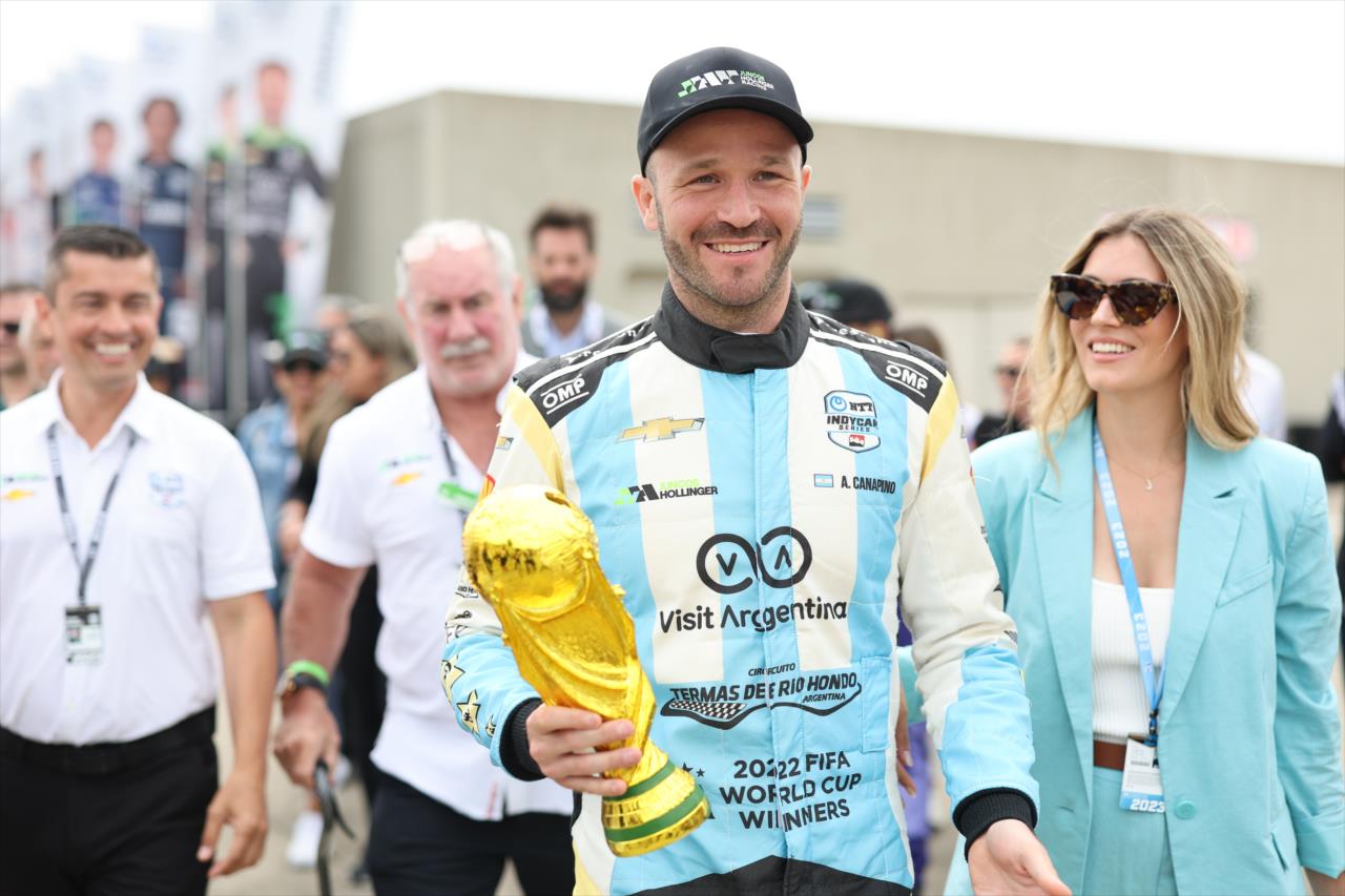 Agustin Canapino, girlfriend Josephina, and the FIFA World Cup Trophy - 107th Running of the Indianapolis 500 Presented By Gainbridge - By: Chris Owens -- Photo by: Chris Owens
