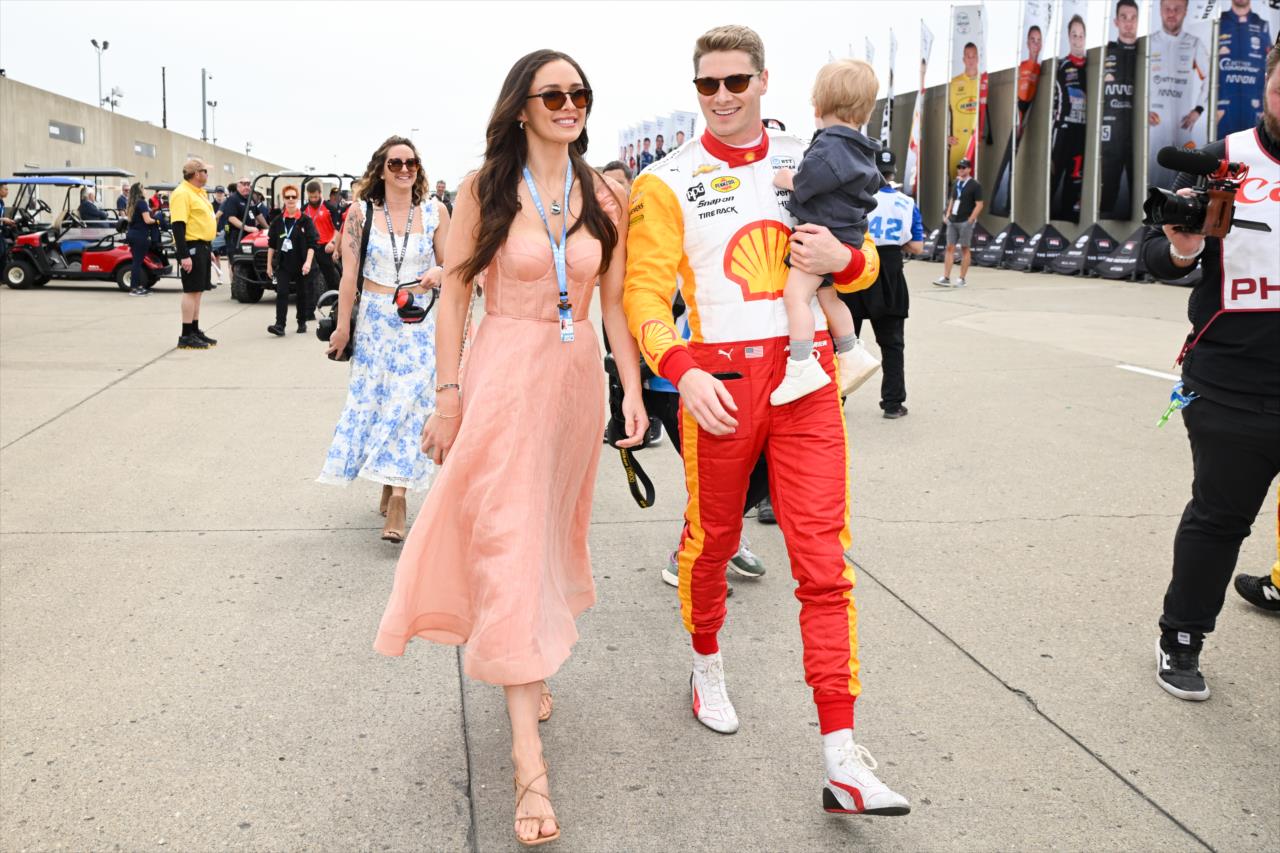 Josef Newgarden walks with his wife, Ashley, and son, Koda - 107th Running of the Indianapolis 500 Presented By Gainbridge - By: James Black -- Photo by: James  Black