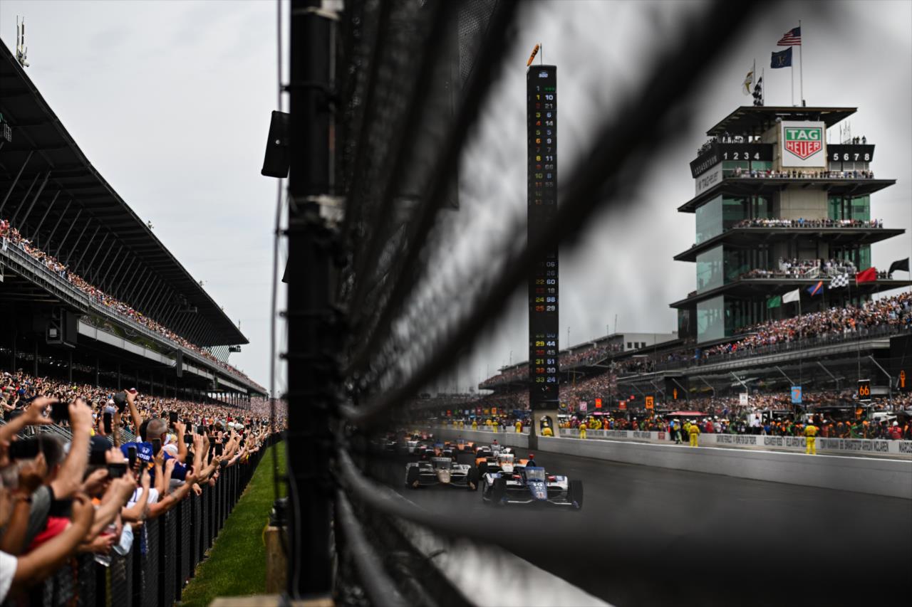 Alex Palou leads the field into Turn 1 - 107th Running of the Indianapolis 500 Presented By Gainbridge - By: James Black -- Photo by: James  Black