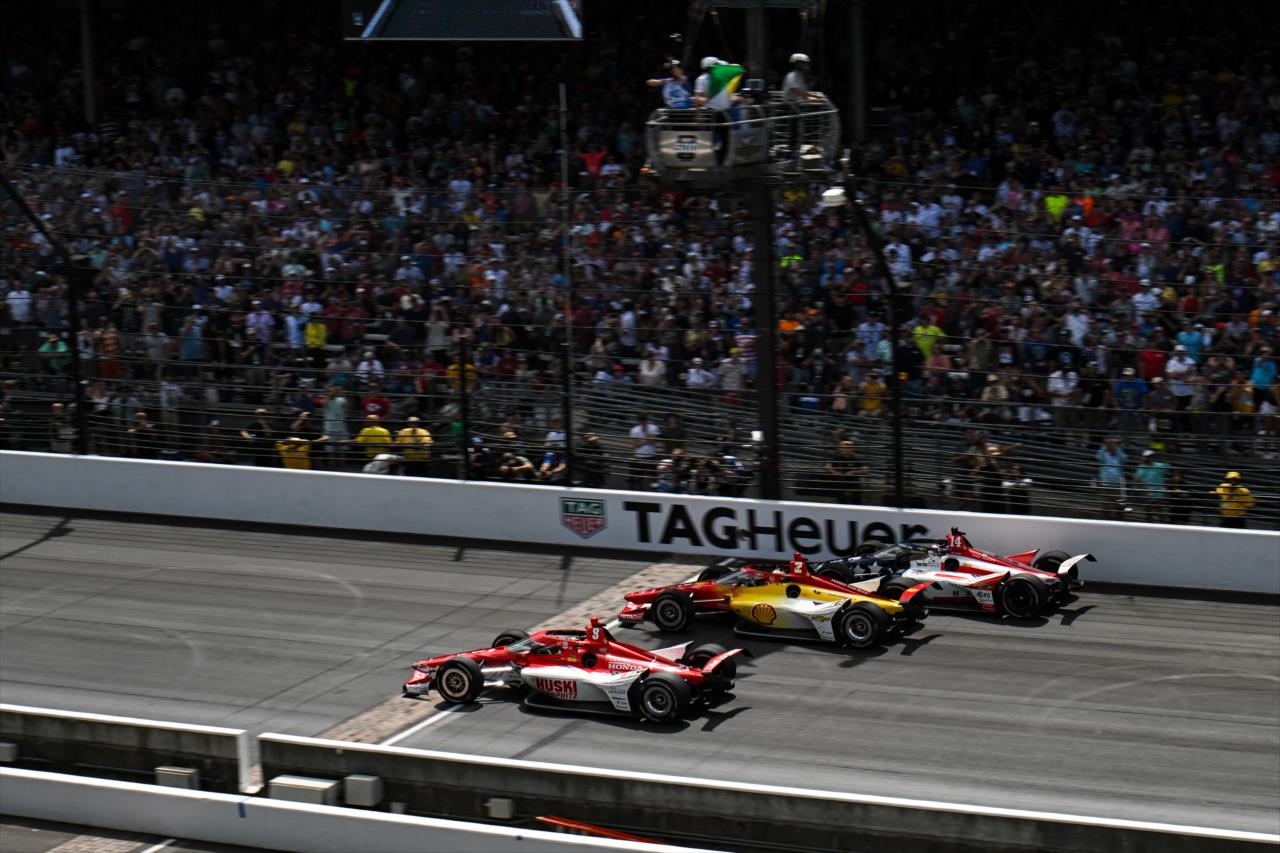 Three-wide at the Yard of Bricks - 107th Running of the Indianapolis 500 Presented By Gainbridge - By: James Black -- Photo by: James  Black