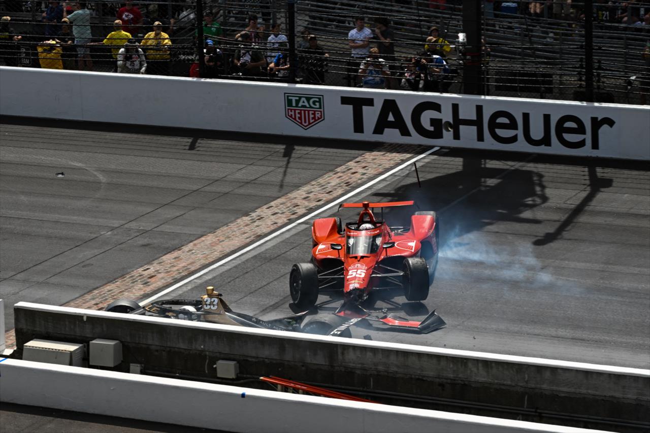 Ed Carpenter and Benjamin Pedersen crash on the frontstretch - 107th Running of the Indianapolis 500 Presented By Gainbridge - By: James Black -- Photo by: James  Black