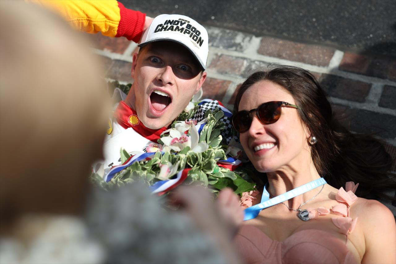 Josef Newgarden and wife, Ashley, celebrate on the Yard of Bricks - 107th Running of the Indianapolis 500 Presented By Gainbridge - By: Joe Skibinski -- Photo by: Joe Skibinski