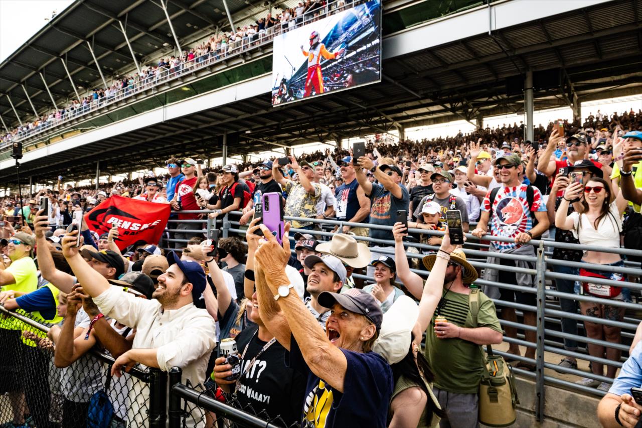 Fans celebrate the new champion - 107th Running of the Indianapolis 500 Presented By Gainbridge - By: Karl Zemlin -- Photo by: Karl Zemlin