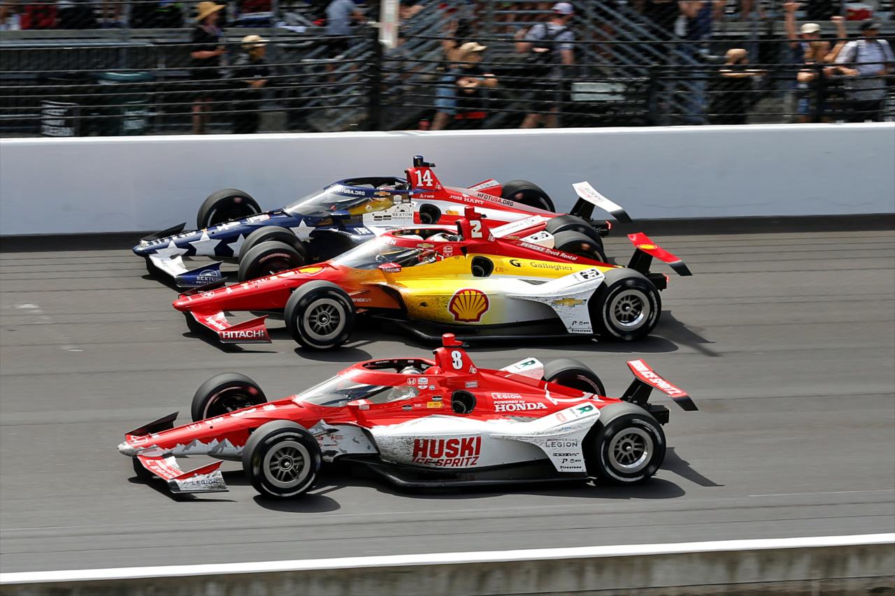 Three-wide excitement - 107th Running of the Indianapolis 500 Presented By Gainbridge - By: Paul Hurley -- Photo by: Paul Hurley