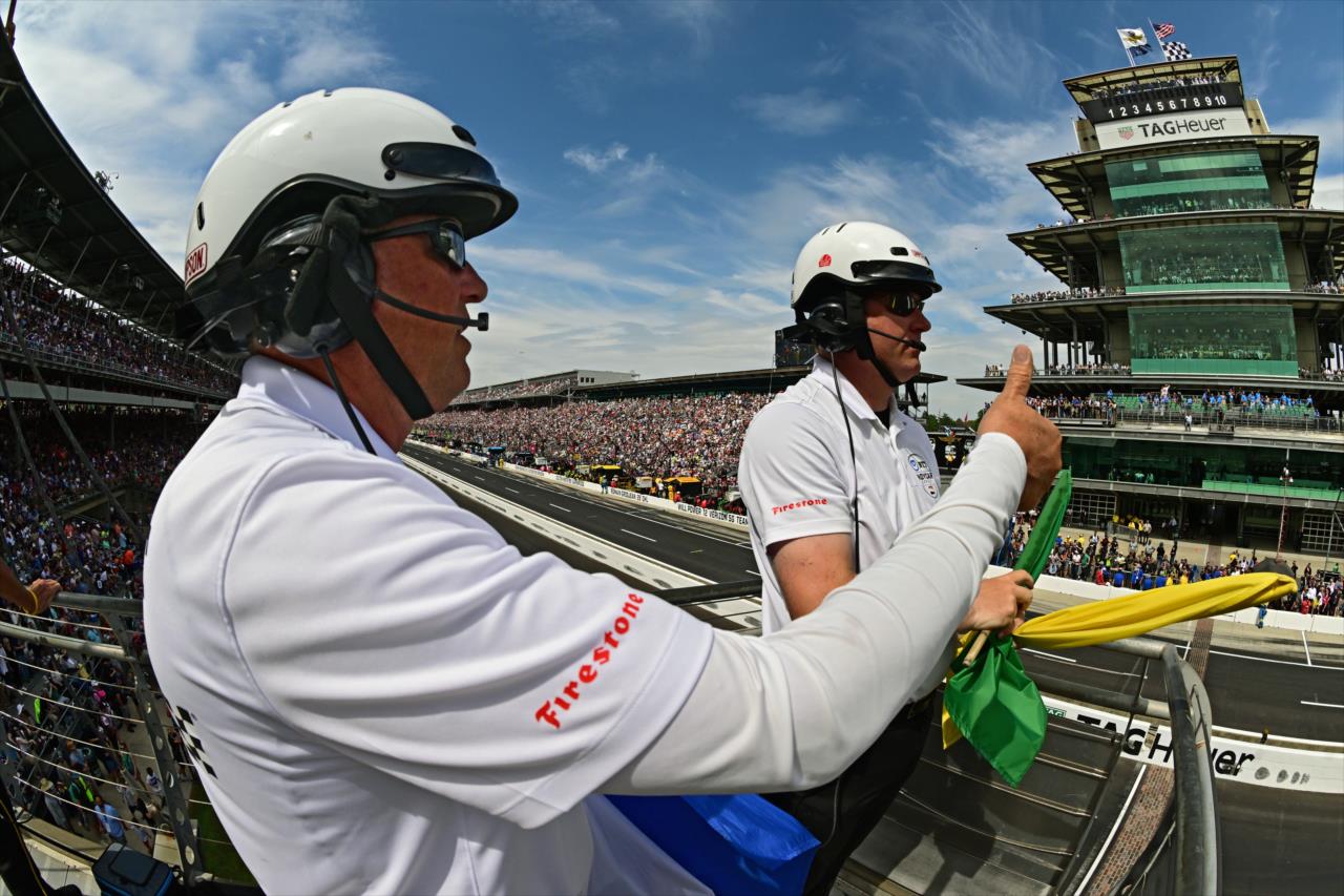 Flagmen watch the field - 107th Running of the Indianapolis 500 Presented By Gainbridge - By: Walt Kuhn -- Photo by: Walt Kuhn