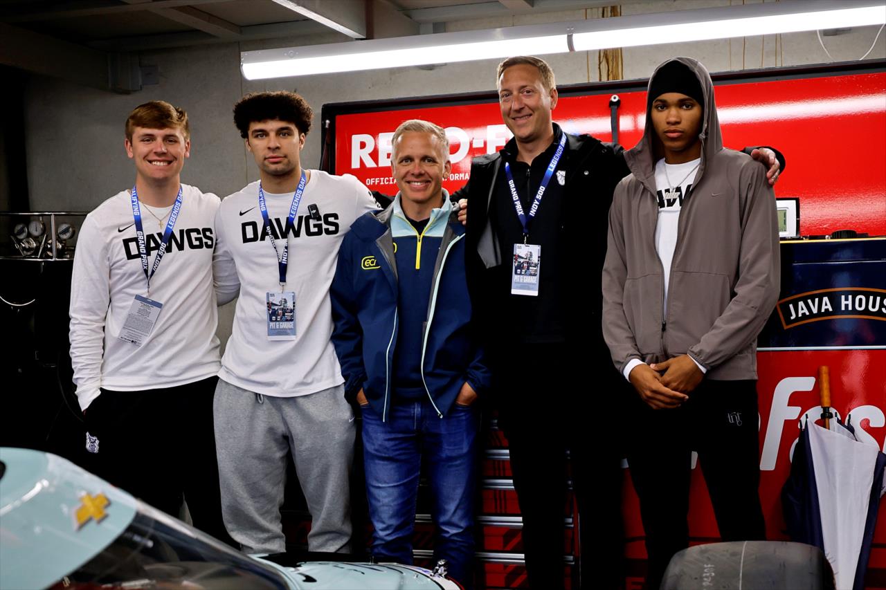 Ed Carpenter with Butler Basketball players - Indianapolis 500 Practice - By: Paul Hurley -- Photo by: Paul Hurley