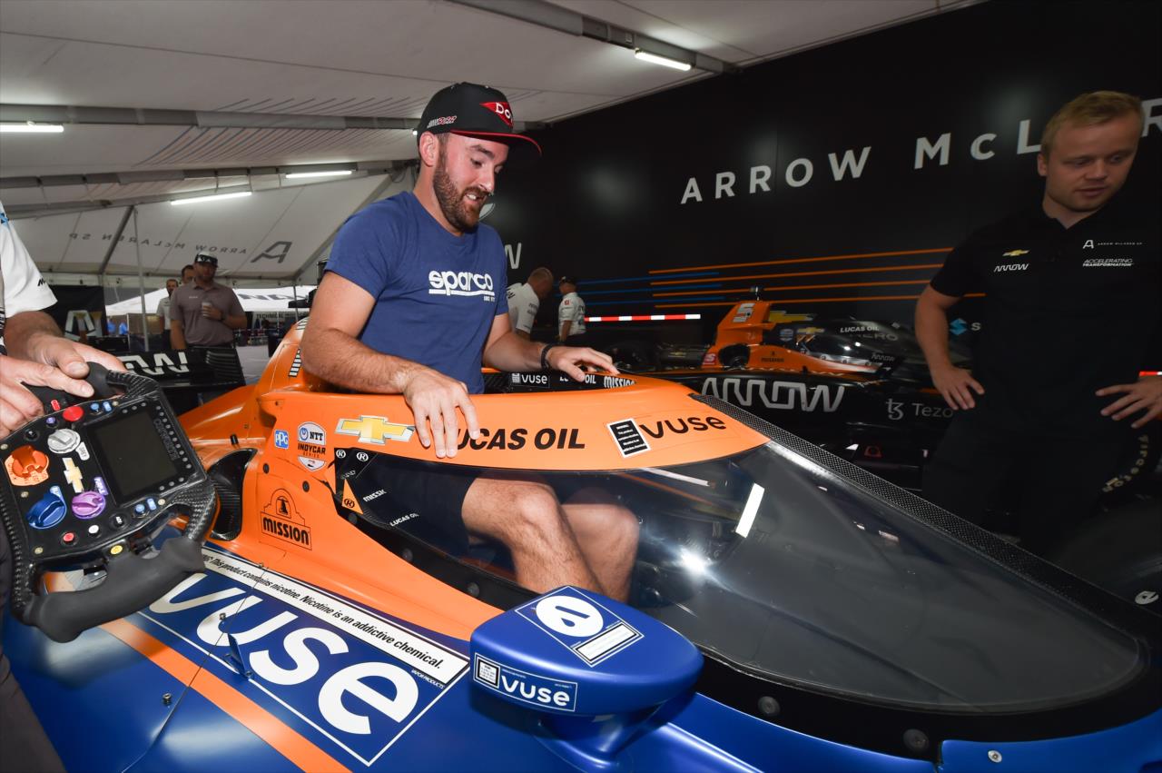 NASCAR Cup Series driver Austin Dillon hops in the seat of Felix Rosenqvist's No. 7 Arrow McLaren SP Chevrolet at IMS on Saturday, Aug. 14. -- Photo by: Chris Owens