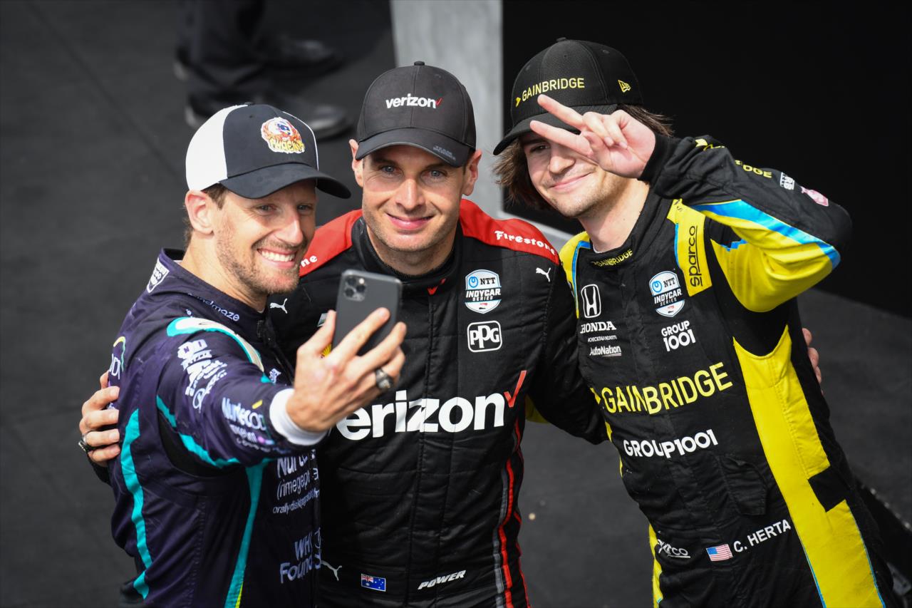 From left, podium finishers Romain Grosjean, Will Power and Colton Herta take a selfie after the Big Machine Spiked Coolers Grand Prix at IMS on Saturday, Aug. 14. -- Photo by: James  Black