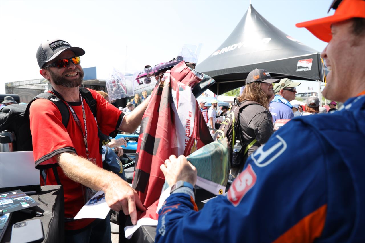 Scott Dixon with with fans - GMR Grand Prix - By: Joe Skibinski -- Photo by: Joe Skibinski