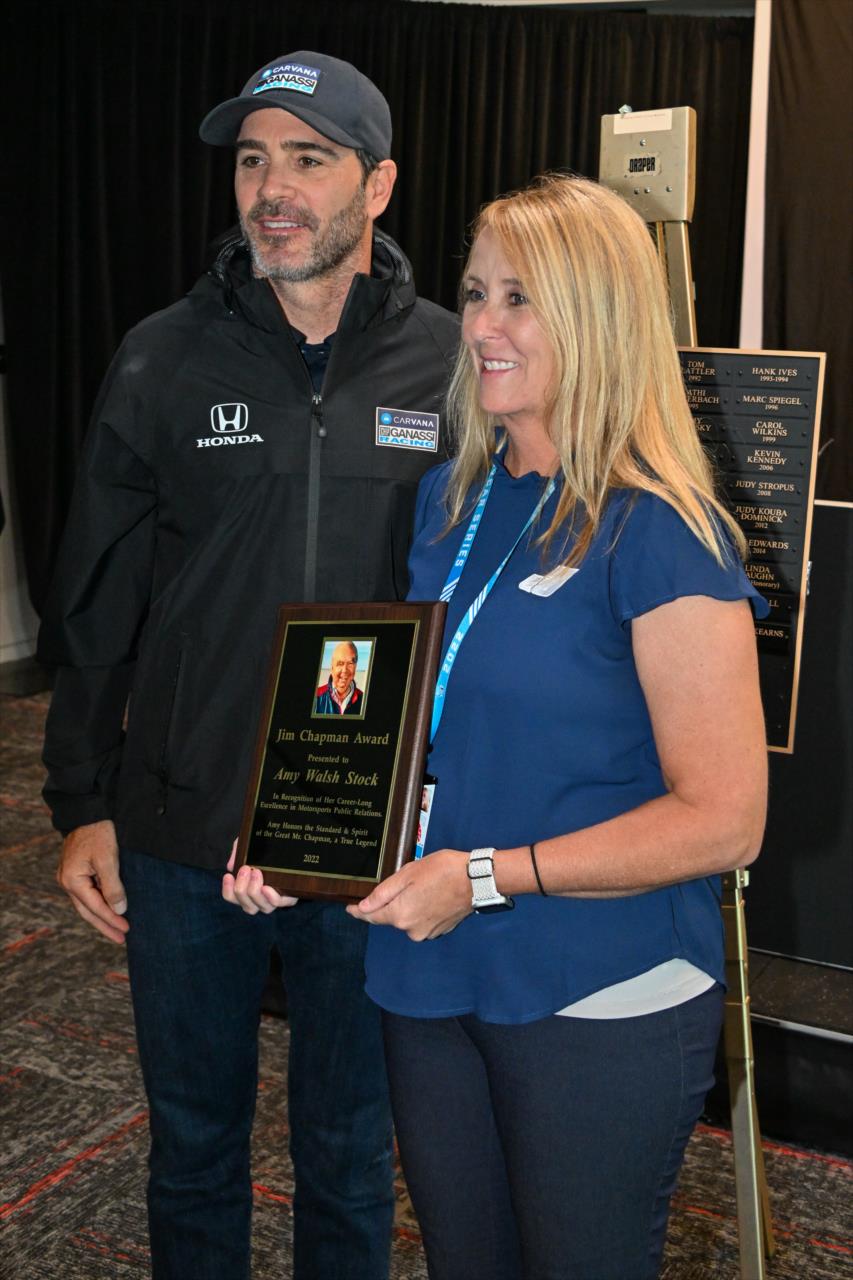 Jimmie Johnson with Amy Walsh-Stock winner of the 2022 Jim Chapman Award for PR excellence - Miller Light Carb Day - by: Doug Mathews -- Photo by: Doug Mathews