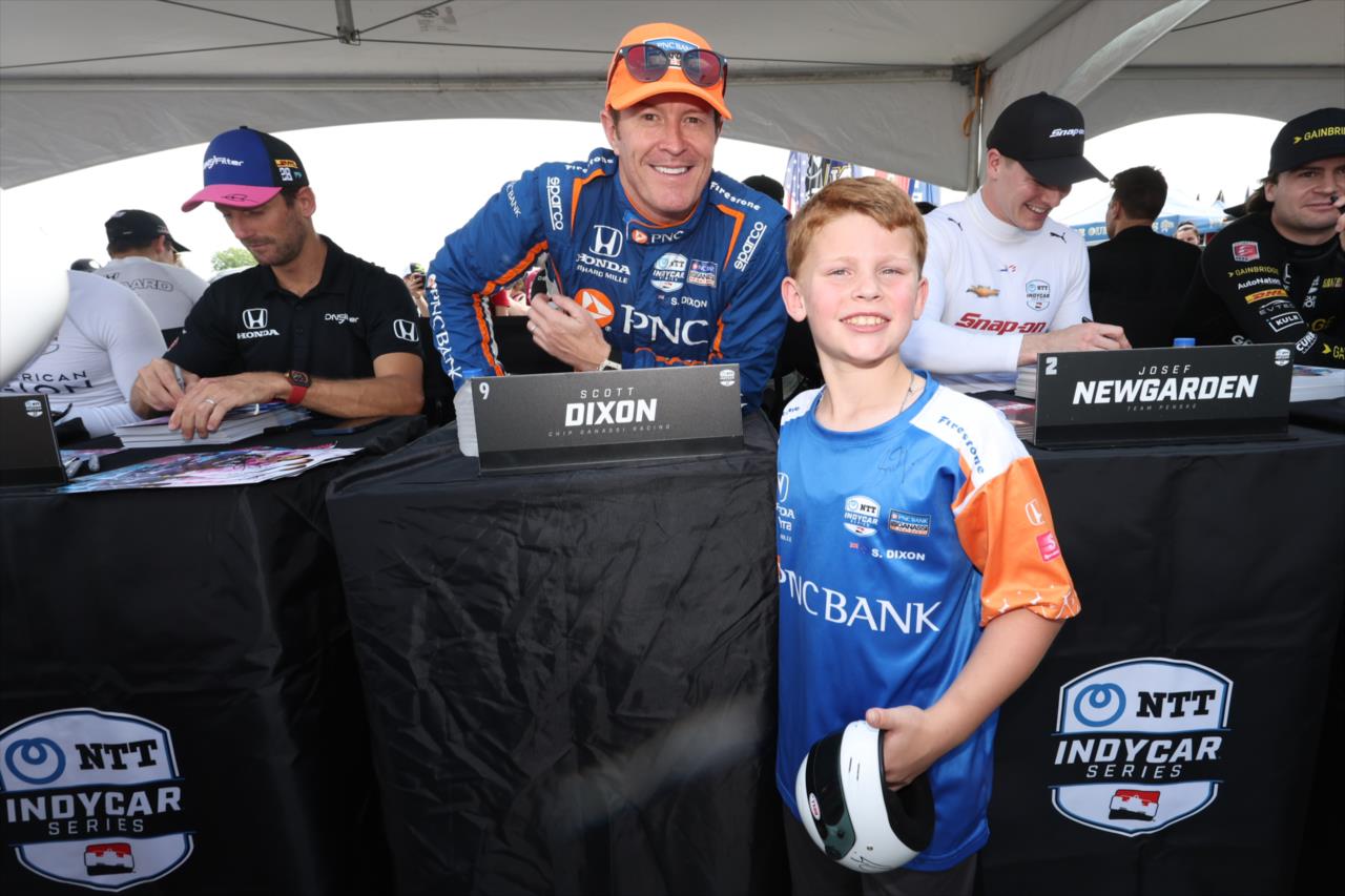 Scott Dixon with a fan - GMR Grand Prix - By: Chris Owens -- Photo by: Chris Owens