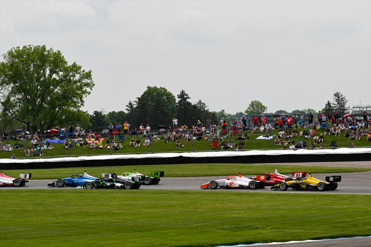 The field in turn 2 - INDY NXT By Firestone Grand Prix - By: James Black -- Photo by: James  Black