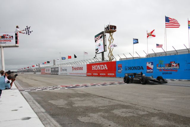 Graham Rahal takes the checker flag at the Honda Grand Prix of St. Petersburg becoming the youngest ever to win an IndyCar Series race. -- Photo by: Ron McQueeney