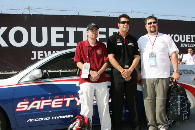 Sam Hornish Jr. Poses with fans in from of the pace car before the Detroit Indy Grand Prix on Race day. -- Photo by: Chris Jones